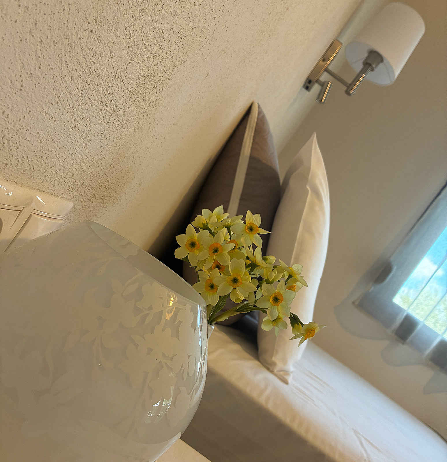 Small floral detail beside a bed at Bloomora.