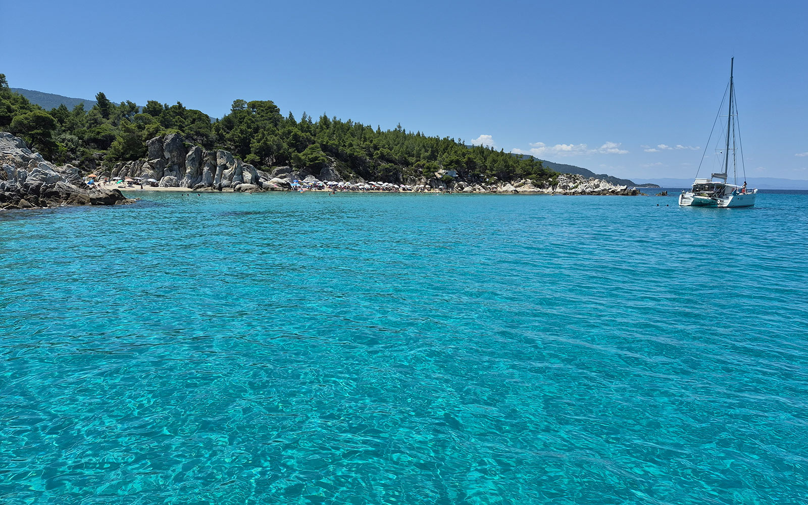Turquoise coves and rocky coastline at Kavourotrypes in Sithonia.