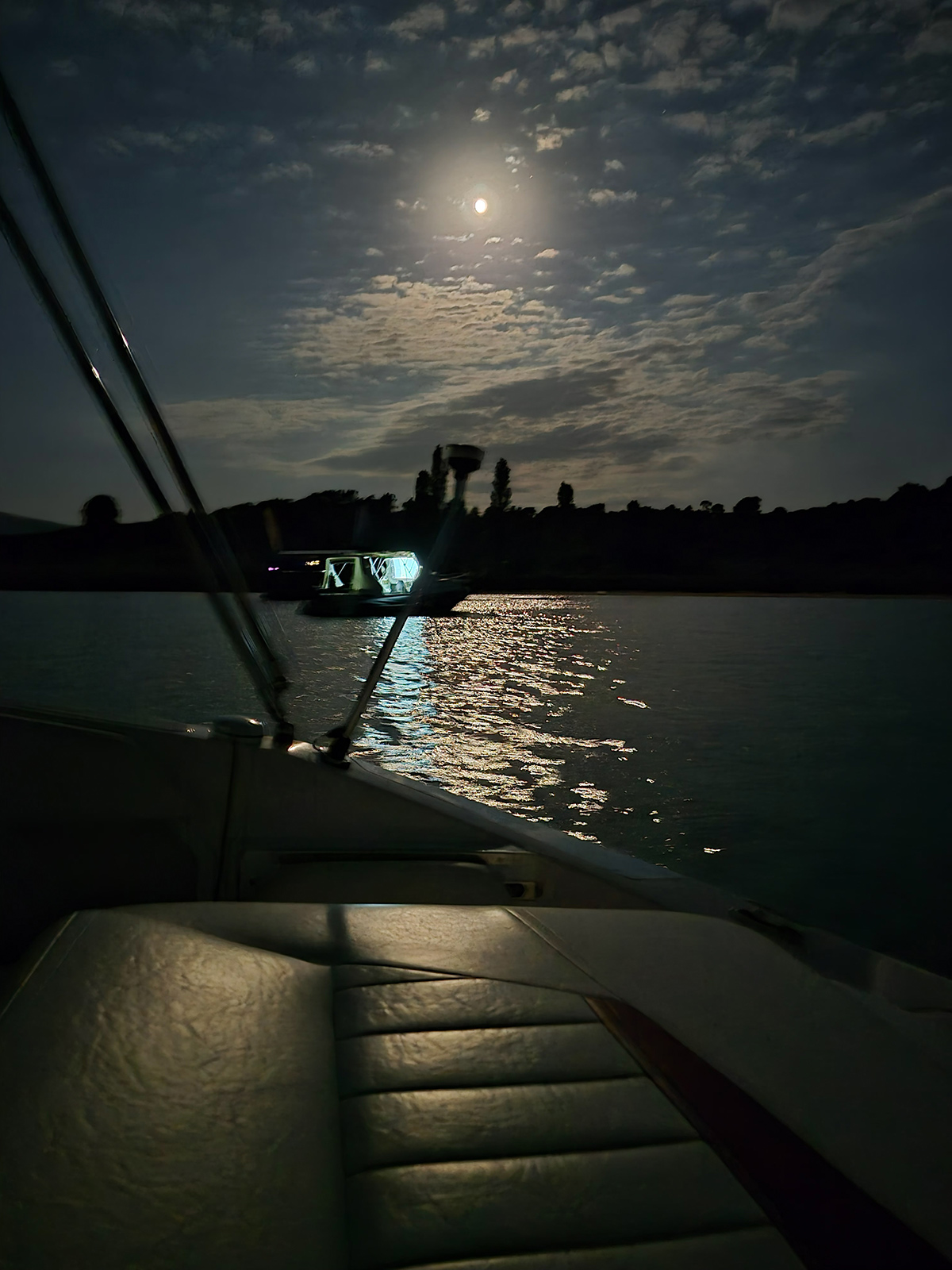 Night view over a quiet cove on Diaporos island.