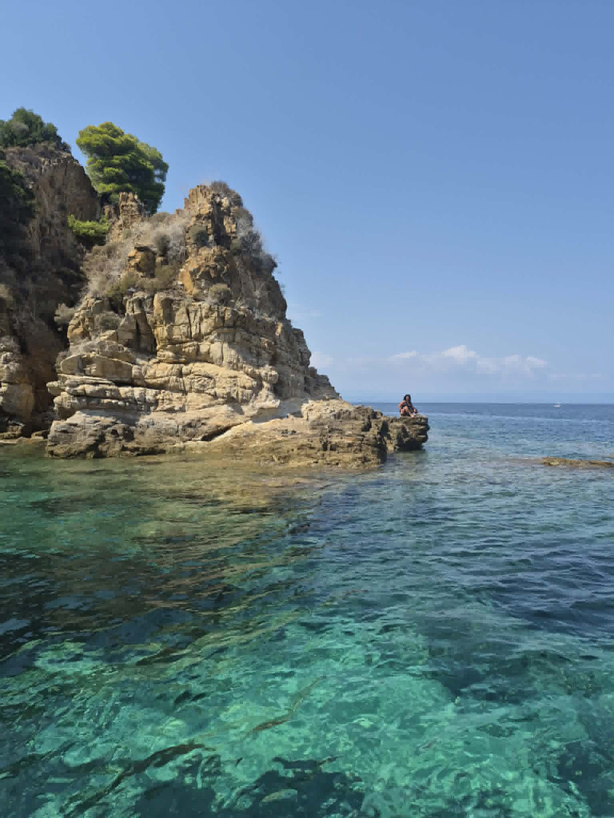 Rocky cove near Karydi with clear blue water in Sithonia.