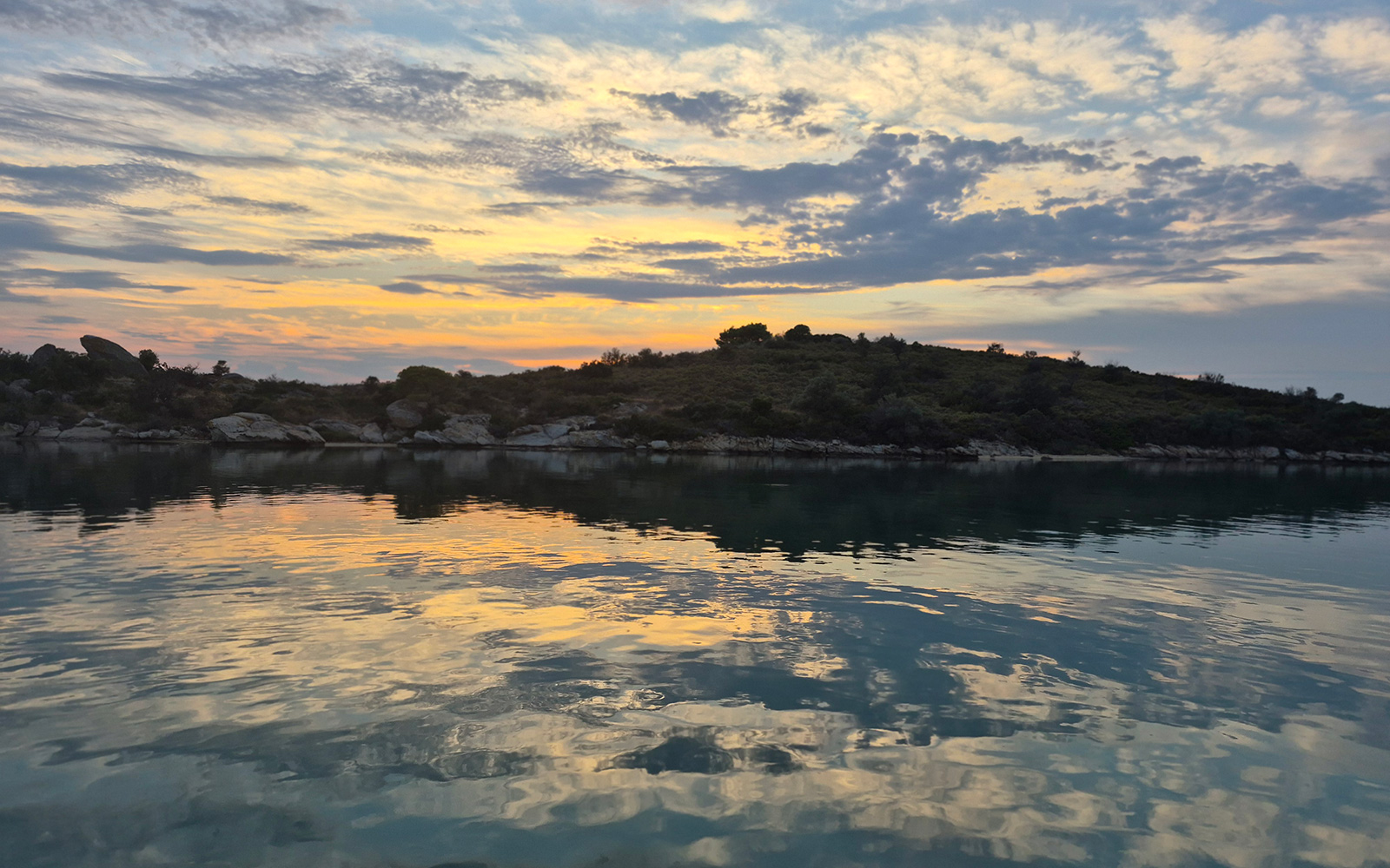 Soft sky and sea view toward Diaporos island in Sithonia.