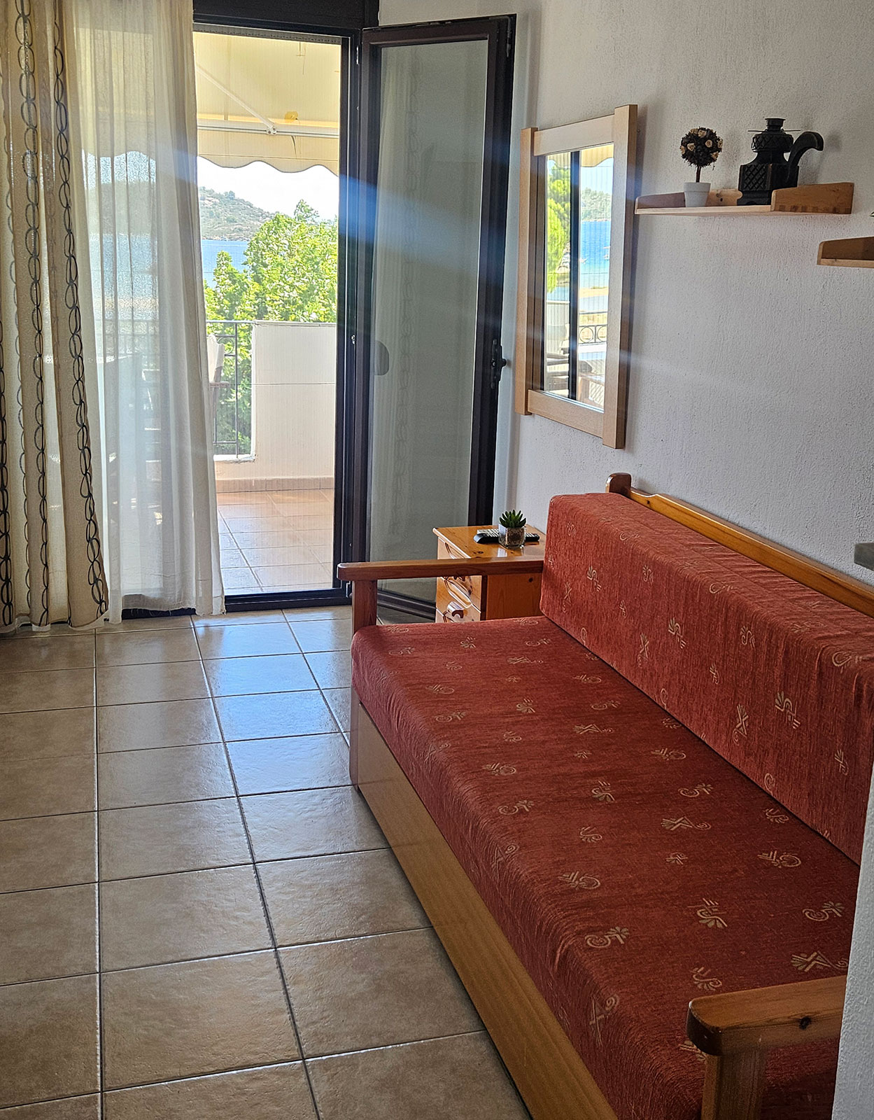 Open-plan room with sofa seating and balcony access in Classic Studio No33.