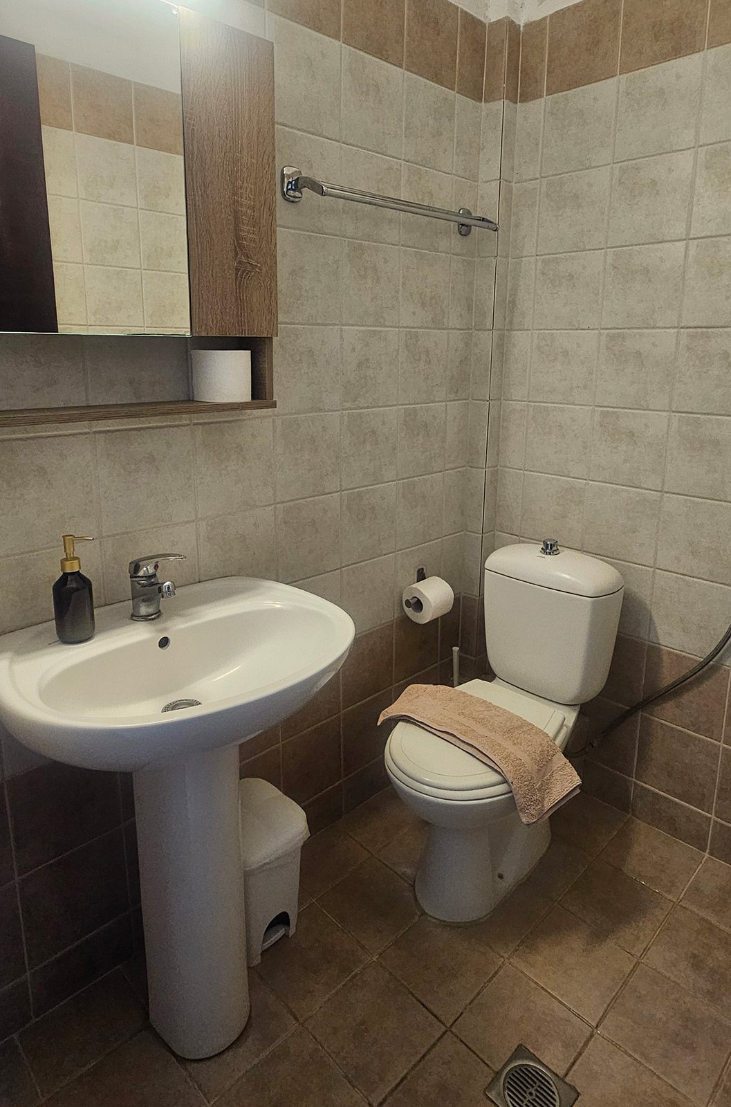 Bathroom with sink, toilet and shower area in Classic Studio No34 at Bloomora.