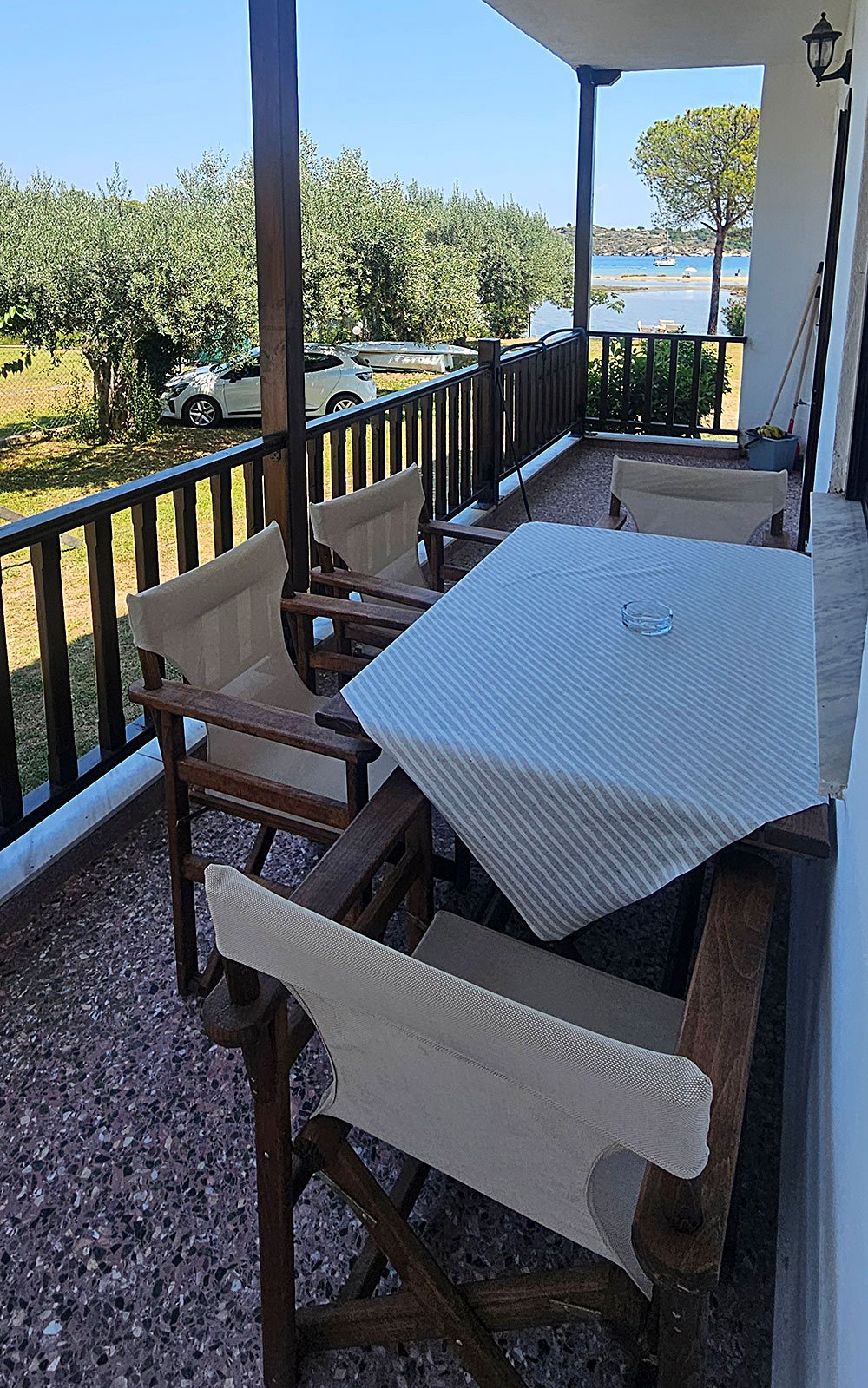 Balcony with seating and sea view from Junior Studio No04 at Bloomora.