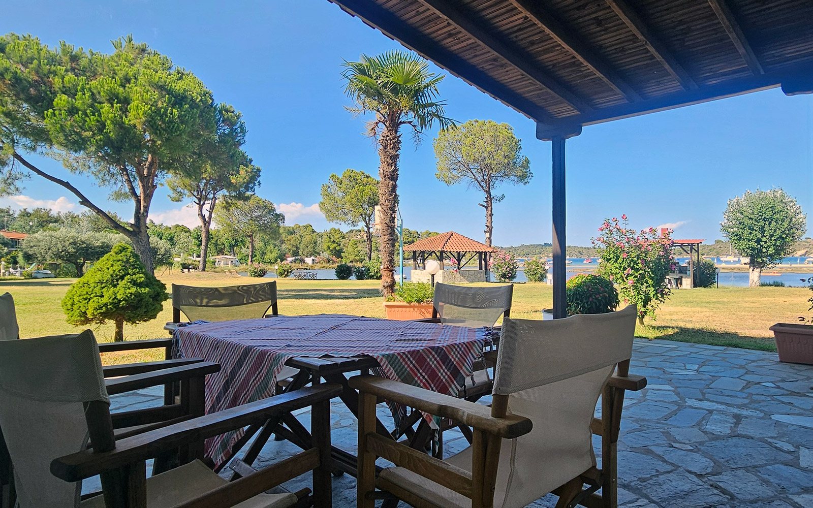 Shaded terrace with garden and sea view from Terrace Studio No13 at Bloomora.