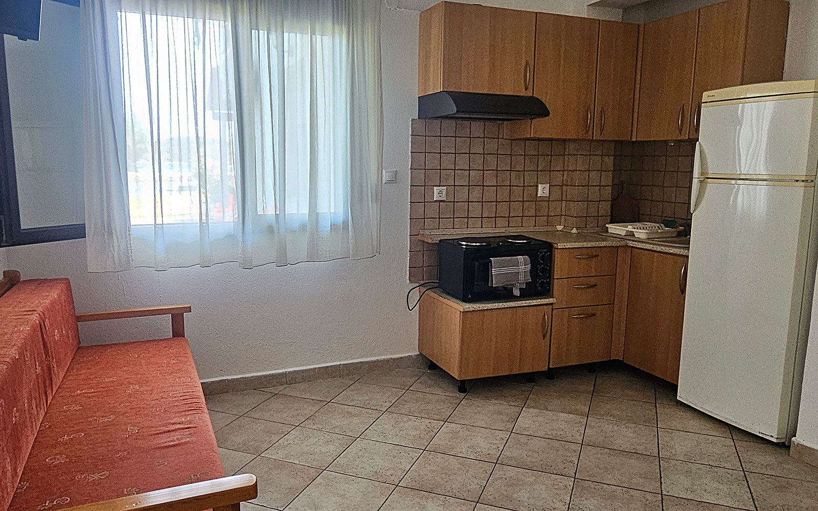 Living area and kitchenette in Terrace Studio No14 at Bloomora.