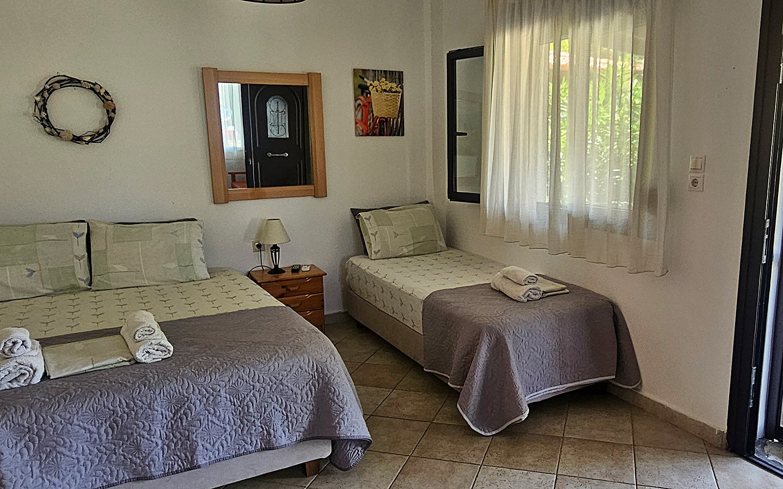 Double bed and single bed in Terrace Studio No14 at Bloomora.